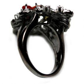 Кольцо из серебра 925 с сапфирами падпараджа и фианитами черное родирование