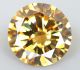 Муассанит карборунд золотистый круглой бриллиантовой огранки 0.76 карат, диаметром 5.9ММ