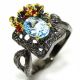 Авторское кольцо ручной работы из серебра 925 с голубым топазом и гранатами родолитами  родирование 2 тона