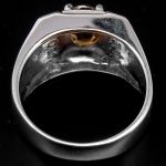 Серебряное кольцо с натуральным цирконом оттенка топаза и фианитами